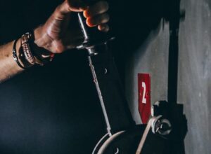 person holding black lever