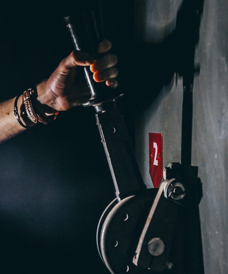 person holding black lever